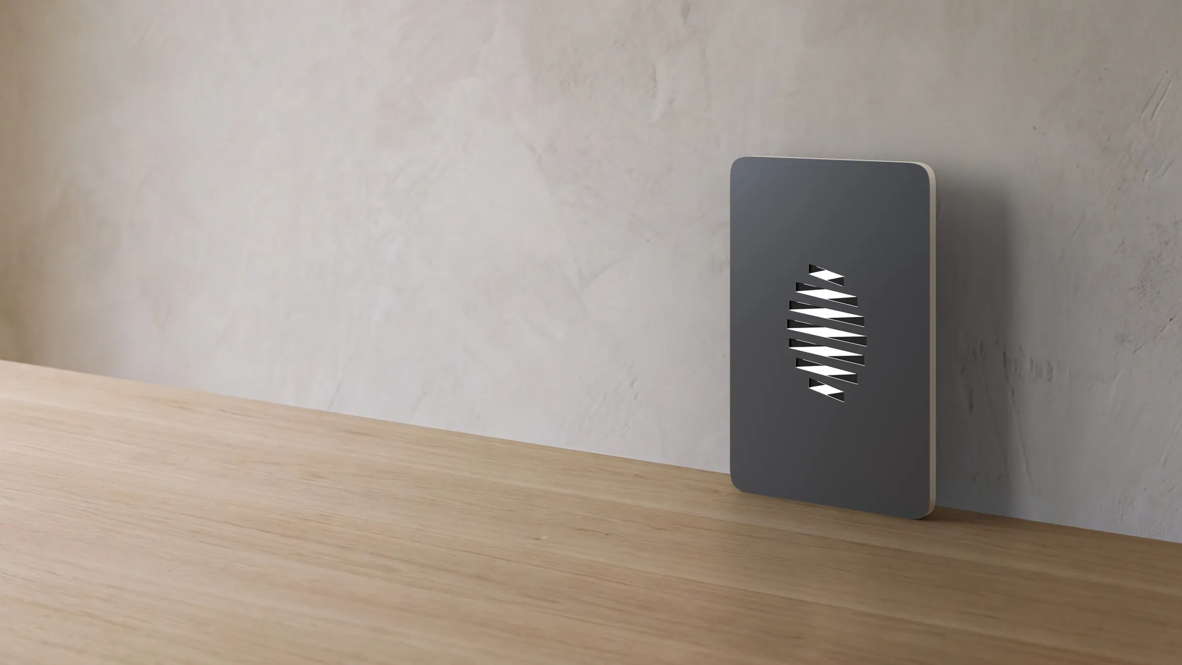 An Eigna Box leaning against a pale wall on an oak floor in daylight