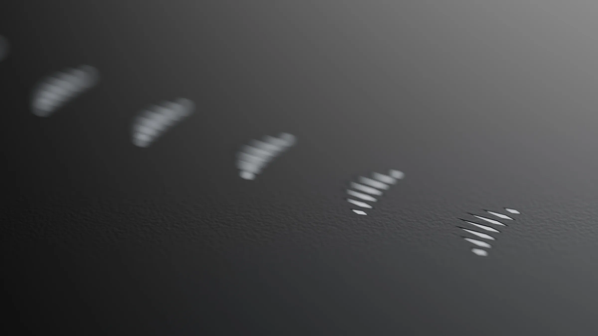 Release marks of the Figure in a row on pale metal, one for every release