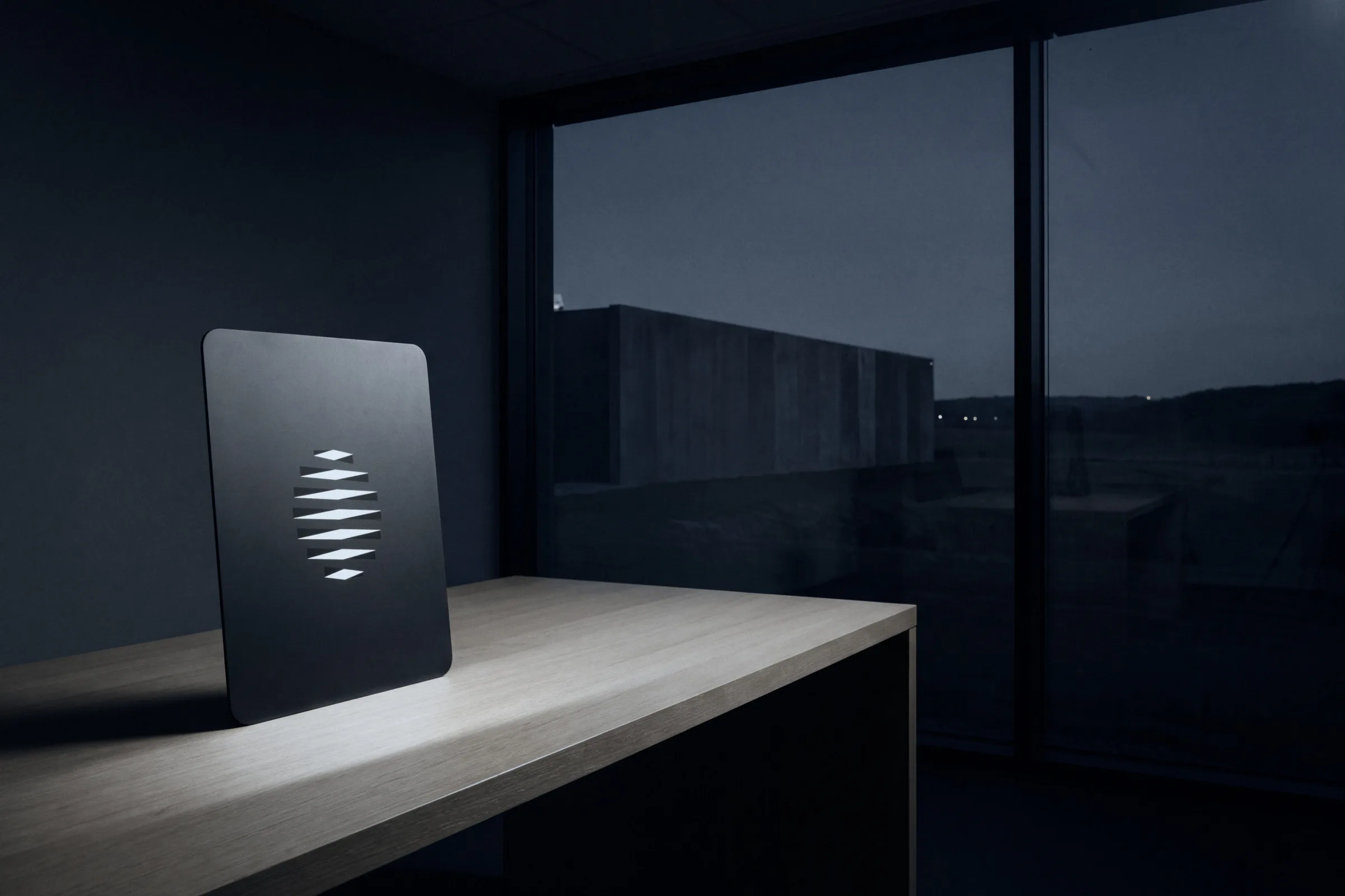 An Eigna Box on a desk by a window at dusk